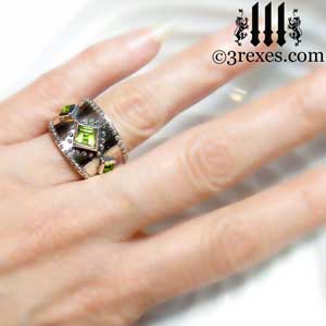 3-wishes-silver-medieval-wedding-ring-gothic-green-peridot-stones-wide-studded-band-model-hand