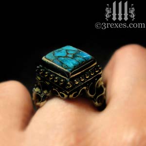 brass-raven-love-ring-blue-topaz-cocktail-ring-on-medieval-model