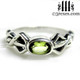 silver friendship ring with green peridot stone