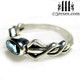 silver friendship ring with blue topaz stone side view