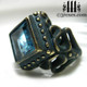 raven love brass wedding ring with large blue topaz stone side detail