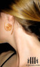 model wearing copper spiral earrings 