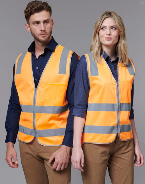 Two individuals wearing bright orange safety vests with reflective stripes, one male and one female, against a neutral background.