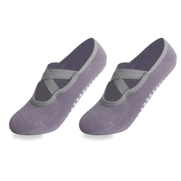 A pair of grey yoga socks featuring a crisscross design and non-slip grip dots on the soles.