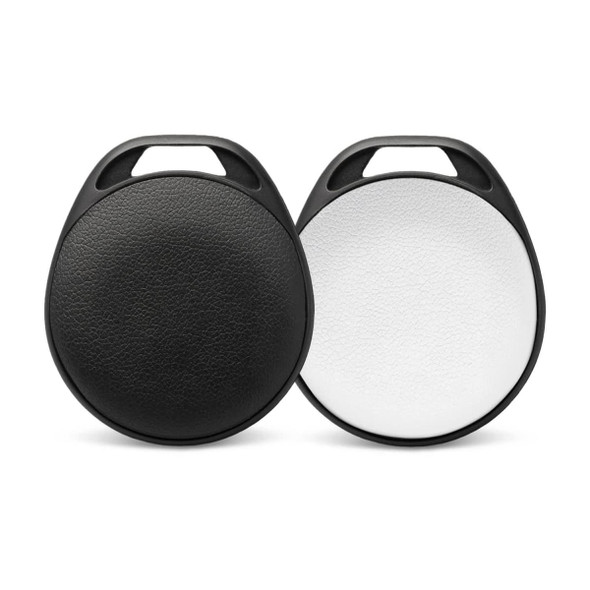 A pair of round Bluetooth trackers in black and white, featuring a textured surface and a hole for attachment.