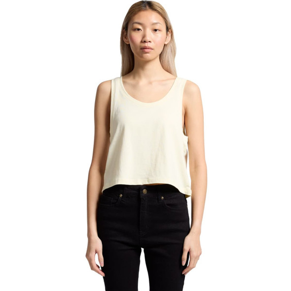 A cropped singlet in pale yellow worn with black pants, featuring a simple design and a small logo. A cropped singlet in pale yellow worn with black pants, featuring a simple design and a small logo.
