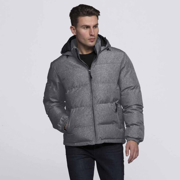 A man is wearing a grey puffer jacket with a hood, featuring side pockets and a front zipper.