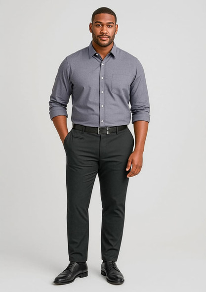A man stands wearing a grey shirt and black stretch chino pants, complemented by a black belt and shoes.