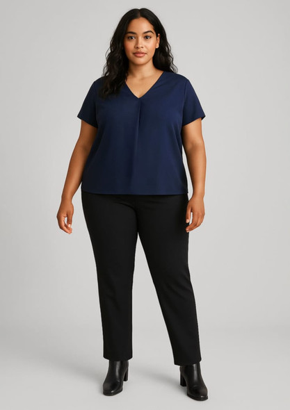 A model wears a navy top paired with black mid-rise pull-on pants, featuring a logo on the waistband.