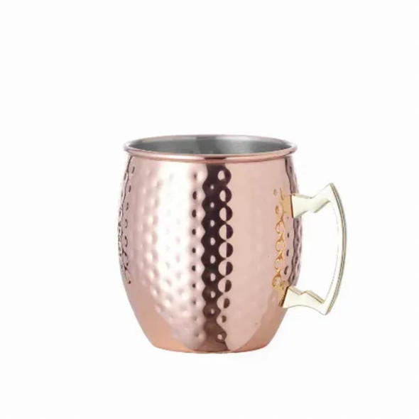 A copper beer mug with a hammered finish and a gold handle, featuring a logo on the side.