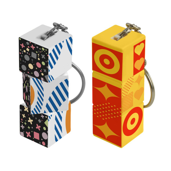 Custom square cubes in vibrant designs, featuring a mix of geometric patterns and a keyring attachment.