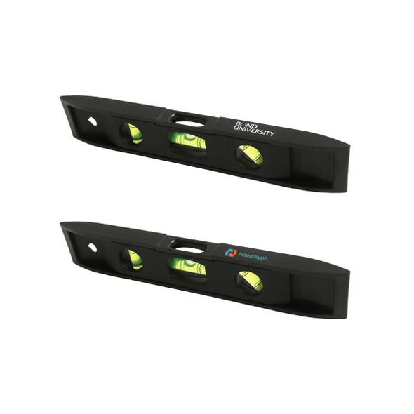 A black magnetic torpedo level featuring two spirit vials and logos on either side.