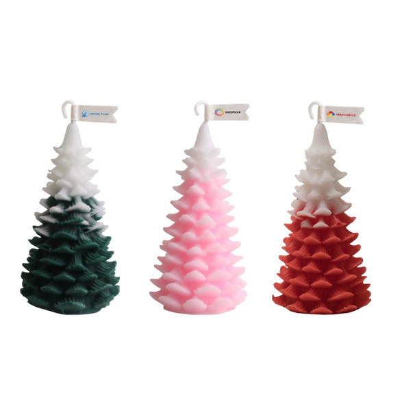Cedar Christmas tree-shaped candles in green, pink, and red, featuring a decorative logo flag on each. Cedar Christmas tree-shaped candles in green, pink, and red, featuring a decorative logo flag on each.