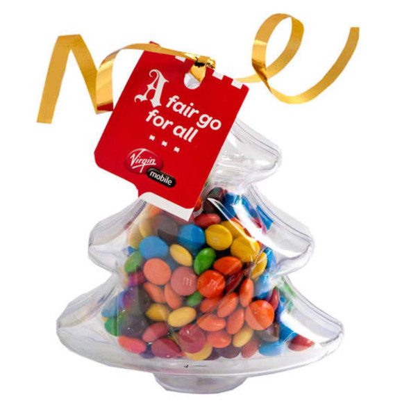 Acrylic Christmas tree filled with colourful M&Ms, featuring a red tag and a gold ribbon.