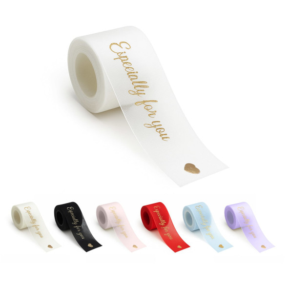 A roll of organza ribbon in various colours, including white, black, pink, red, and lavender, featuring a heart design. A roll of organza ribbon in various colours, including white, black, pink, red, and lavender, featuring a heart design.