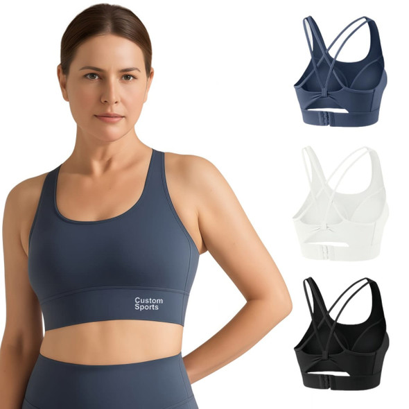 A women's cross back yoga crop bra tank in navy blue, white, and black, featuring a logo.