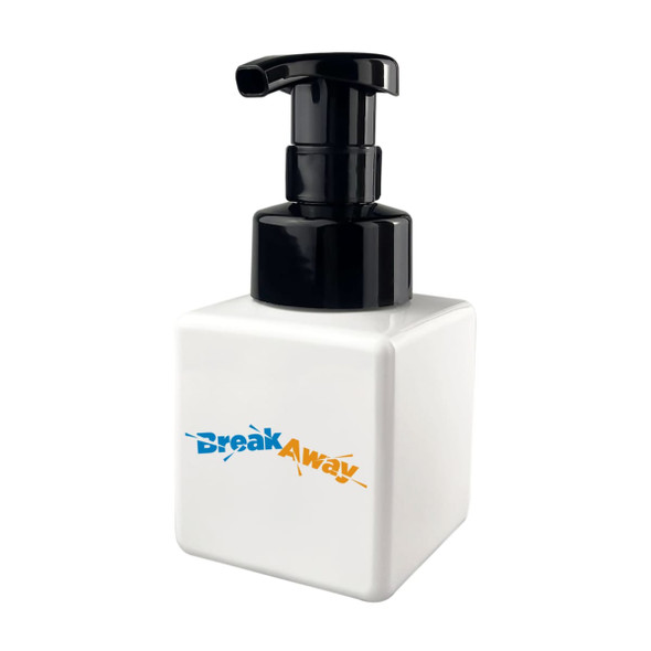 A square white foaming soap dispenser with a black pump top, featuring a logo on the front.