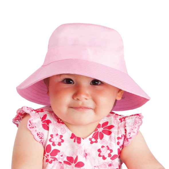 A pink twill bucket hat with a wide brim, featuring a toggle for adjustment. Suitable for kids.