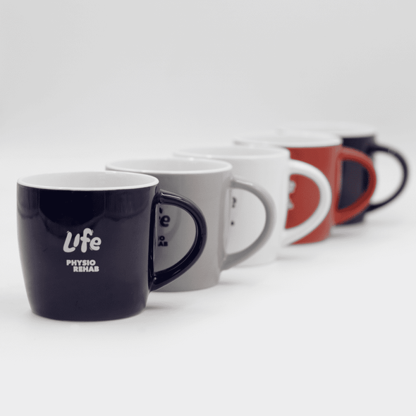 A ceramic mug collection featuring black, grey, white, and red mugs, each with a logo design.