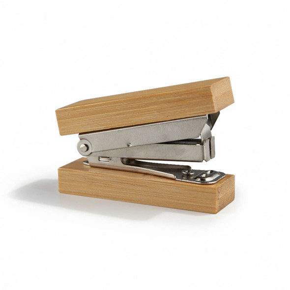 A bamboo stapler with a silver metal mechanism, featuring a natural wood finish.