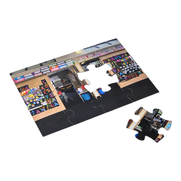 A5 Magnetic Jigsaw featuring a classroom scene with colourful educational posters and black flooring. One piece is detached.