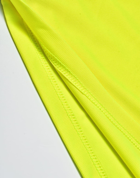 A close-up of a bright yellow polo shirt showing the fabric texture and stitching details.