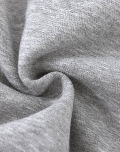 A close-up of soft, grey fabric with a slight texture, typical of a fleece jumper. It features a logo.
