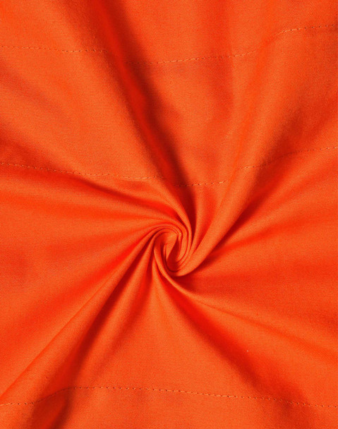 An orange fabric with visible stitching, showcasing a swirling pattern. The material appears heavy-duty and suitable for workwear.