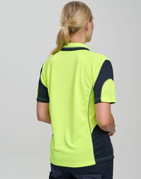 A high-visibility polo shirt featuring bright yellow-green and navy blue colours, with a branding logo.