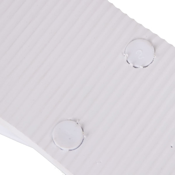 A close-up of white EVA material with ribbed texture and circular indentations. The image features a logo.