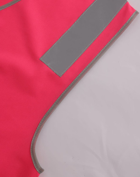A bright pink safety vest featuring reflective shoulder tapes and contrasting grey edging. It includes a logo.