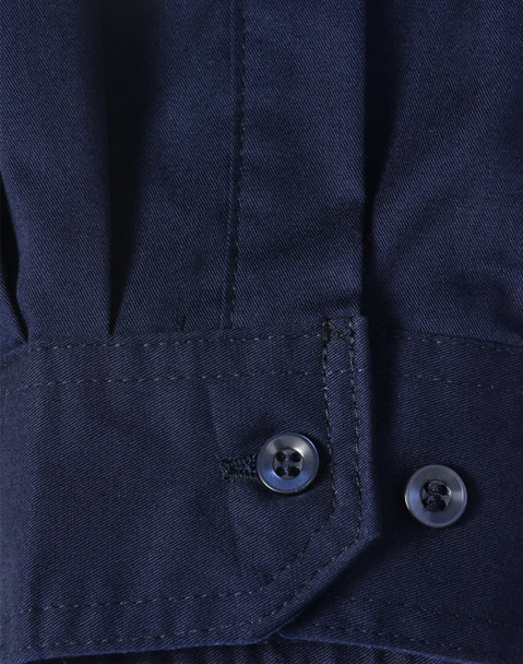 A close-up of a blue long-sleeve shirt featuring segmented tape, with a buttoned cuff detail.