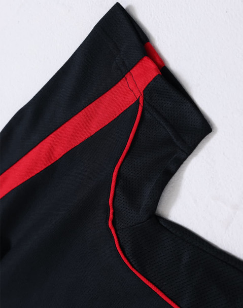 A black polo shirt with red and contrasting details, featuring a logo on the sleeve.