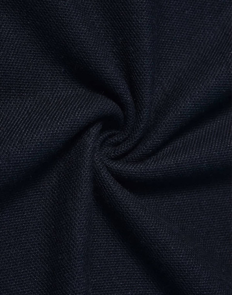 A close-up of dark navy fabric, showcasing a textured, woven pattern.