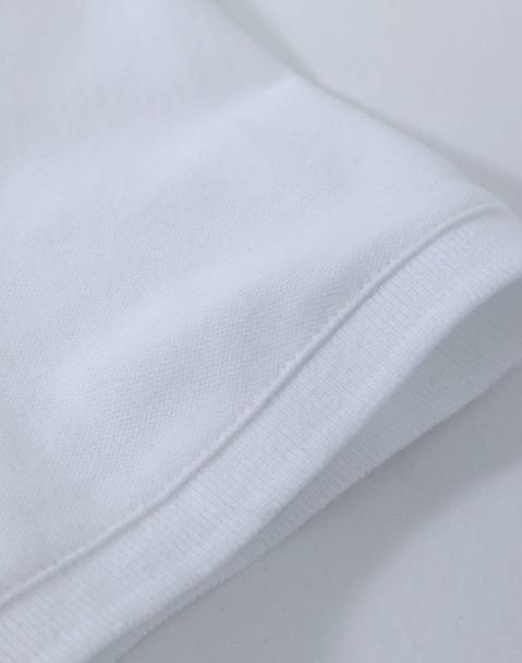 A white ladies cotton stretch polo shirt, featuring a classic collar and short sleeves, with a logo present.