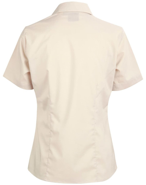 A beige short sleeve button-up shirt with a fitted design and a collar, featuring a logo on the back.