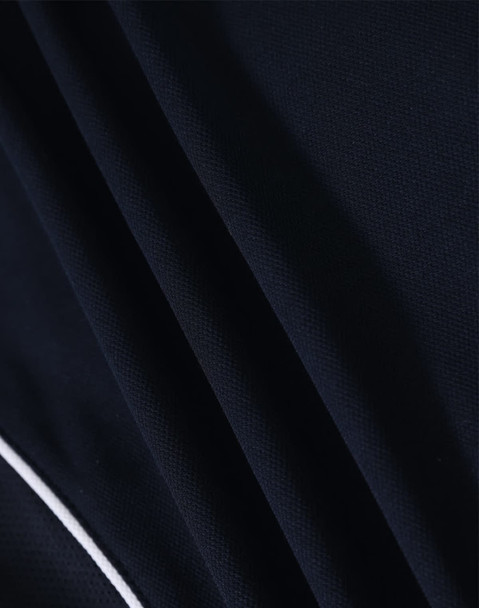 A navy blue ladies' polo shirt featuring textured fabric and a contrasting trim. It includes a logo.