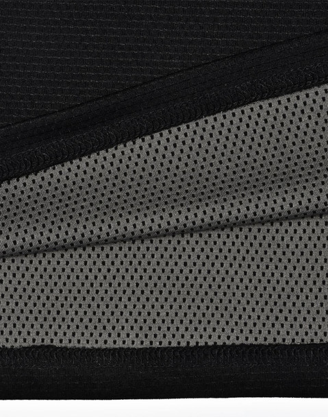 A close-up of a black polo shirt featuring a breathable grey mesh fabric beneath. The shirt includes a logo.