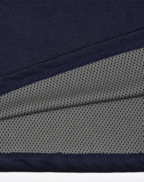 A close-up of a navy polo shirt detailing with a grey mesh inner lining, featuring a logo.