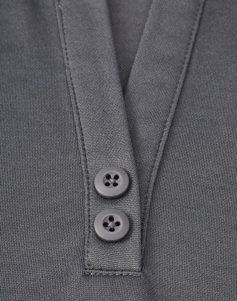 A close-up of a grey polo shirt featuring a placket with two black buttons and a sustainable fabric blend.