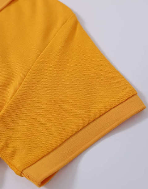 A close-up of a yellow polo shirt sleeve with a textured fabric and cuff detail. The shirt has a logo.
