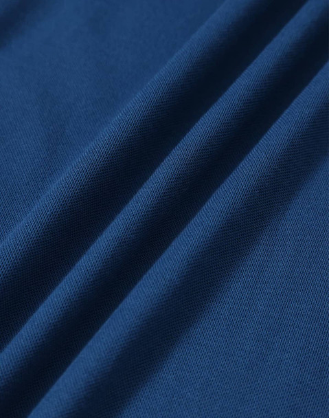 A close-up of a textured fabric in deep blue, featuring soft drapes and folds. The fabric is suitable for polo shirts.