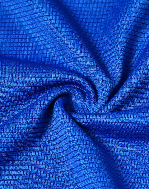 A close-up of blue textured fabric, showcasing a lightweight and performance-oriented material.