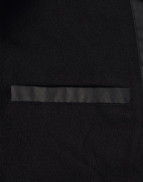 A close-up of a black long line stadium jacket featuring a sleek design and a pocket. The jacket has a branding logo.
