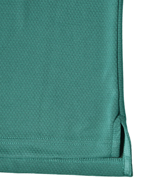 A close-up view of a teal men's bamboo charcoal polo shirt, featuring a hem with side splits and a logo.