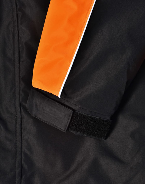 Close-up of a unisex jacket featuring black fabric with orange accents and a velcro cuff. Includes a branding logo.