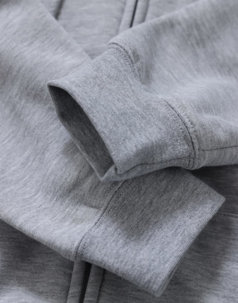 A grey men's full-zip fleecy hoodie with a close-up of the cuffs and fabric texture, featuring a logo.