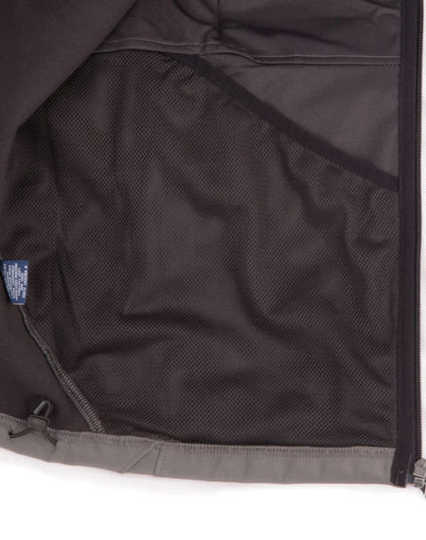 An inside view of a men's softshell high-tech jacket featuring a mesh pocket, predominantly grey in colour.