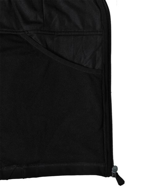 A close-up of the interior of a black softshell jacket, featuring a mesh pocket and zipper detail.