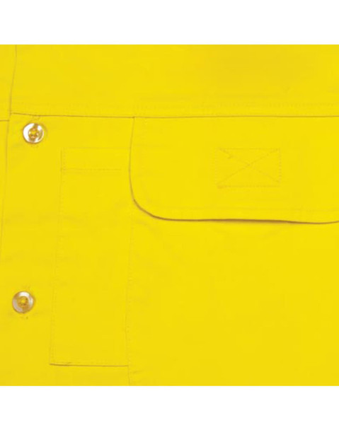 A close-up of a bright yellow, long-sleeve cotton safety shirt featuring snap buttons and a front pocket.